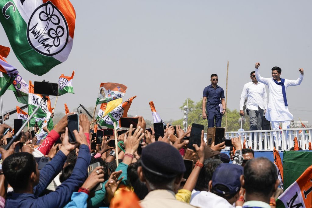 Indian Congress Party politician, Abishek Bannerjee (on the right), danced on stage during a campaign in front of supporters in Kolkata, India on March 10, 2024.