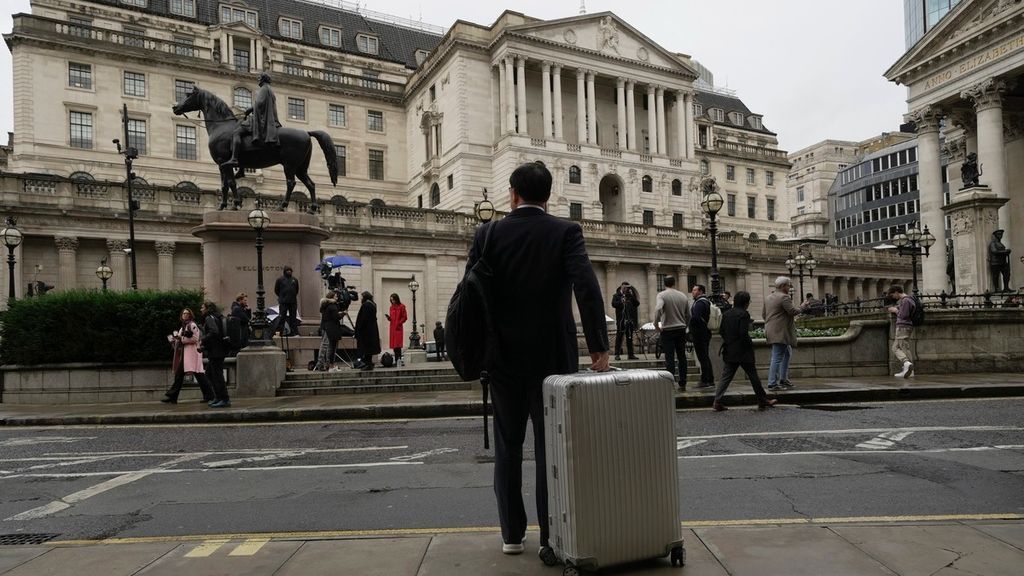 A man stands in front of the Bank of England, at the financial district in London, Thursday, Nov. 3, 2022. The Bank of England has announced its biggest interest rate increase in three decades as it tries to beat back stubbornly high inflation fueled by Russia's invasion of Ukraine and the disastrous economic policies of former Prime Minister Liz Truss. 