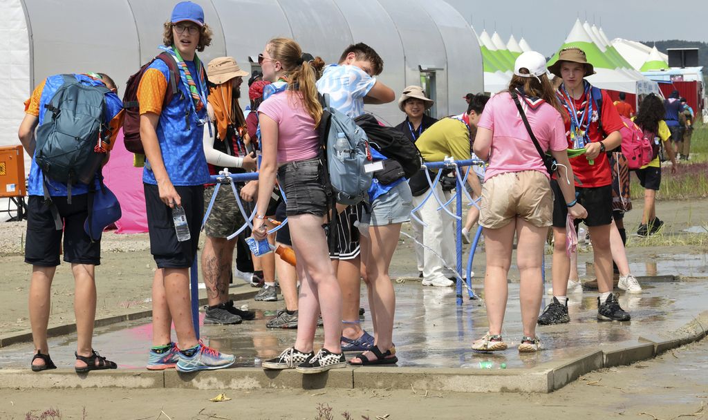 World Scout Jamboree participants cool off with water at a scout camping site in Buan, South Korea on Friday, August 4th, 2023. More than 100 people have been treated for heat-related illnesses as South Korea experiences one of its hottest summers in recent years.
