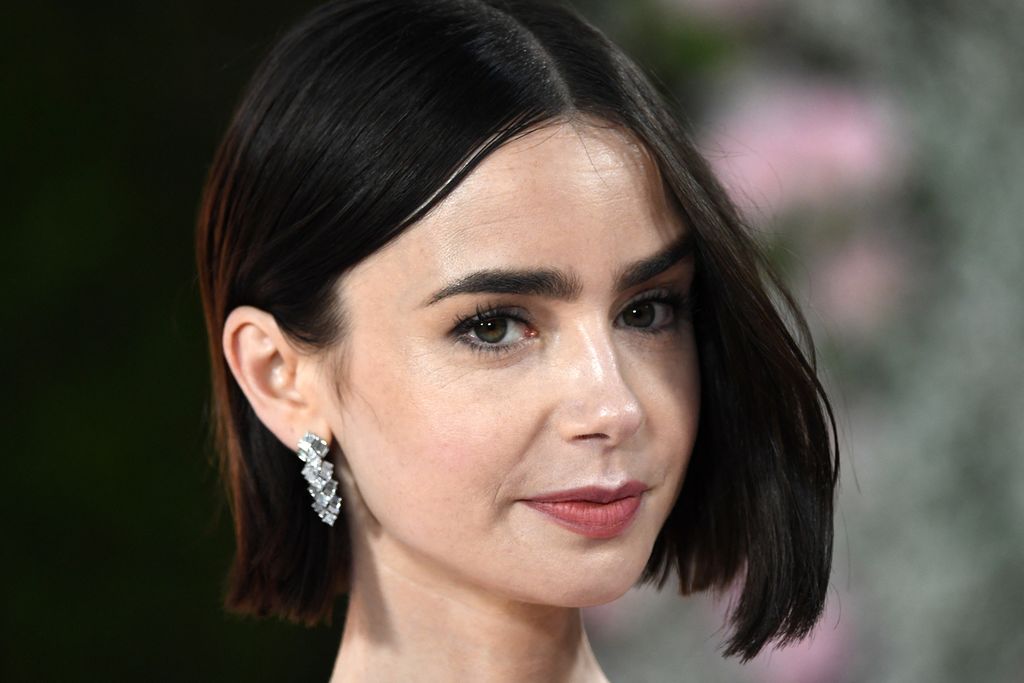  Aktris Amerika Serikat-Inggris, Lily Collins, menghadiri pemutaran perdana <i>Emily in Paris</i> musim keempat, Bagian 1, di Egyptian Theatre, Los Angeles, AS, pada 14 Agustus 2024. Serial ini tayang di Netflix.