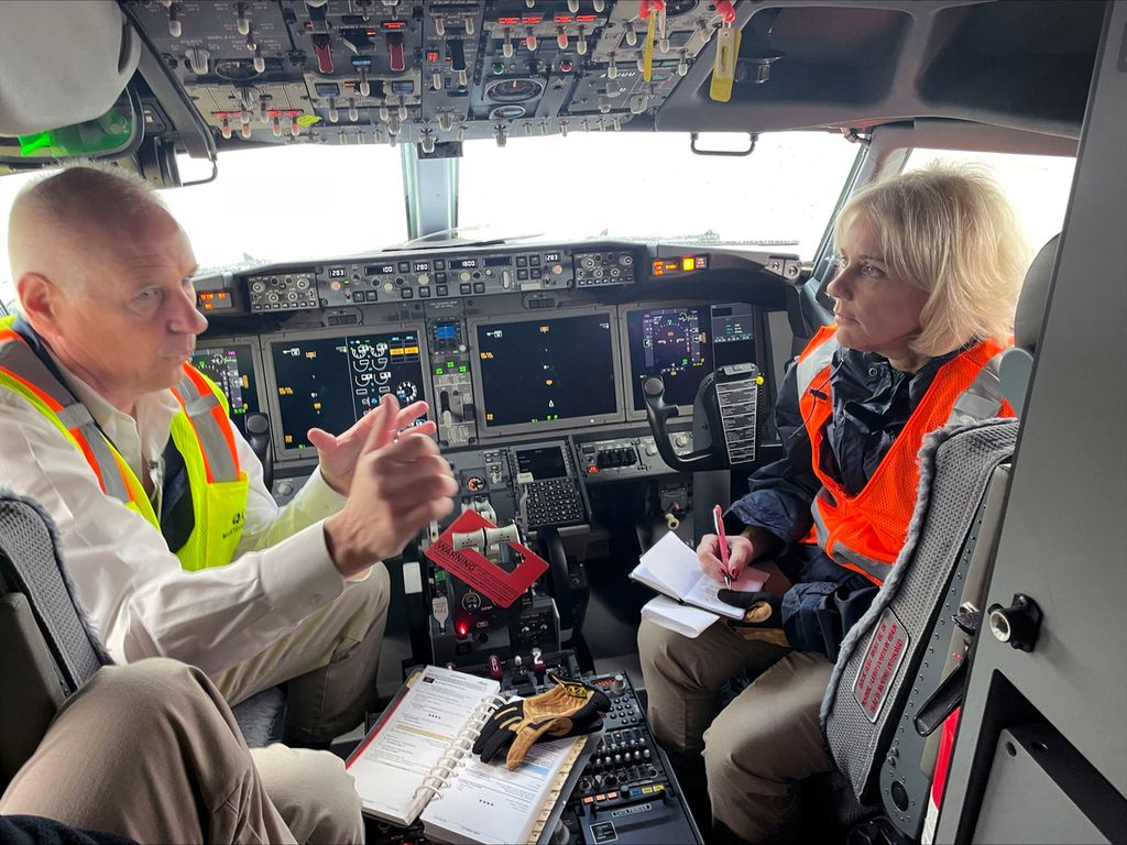 In this photo from the National Transportation Safety Board (NTSB), one investigator is seen speaking in the cockpit while inspecting the Alaska Airlines Flight 1282 Boeing 737-9 MAX on January 7, 2024 in Portland, Oregon, USA.