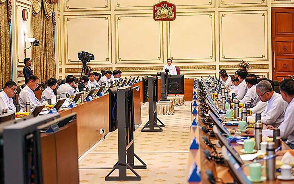 In the photo taken on July 13, 2023 and released on July 14, 2023, Myanmar's senior military junta leader, General Min Aung Hlaing (center), is seen delivering a speech at a government meeting in Naypyidaw.