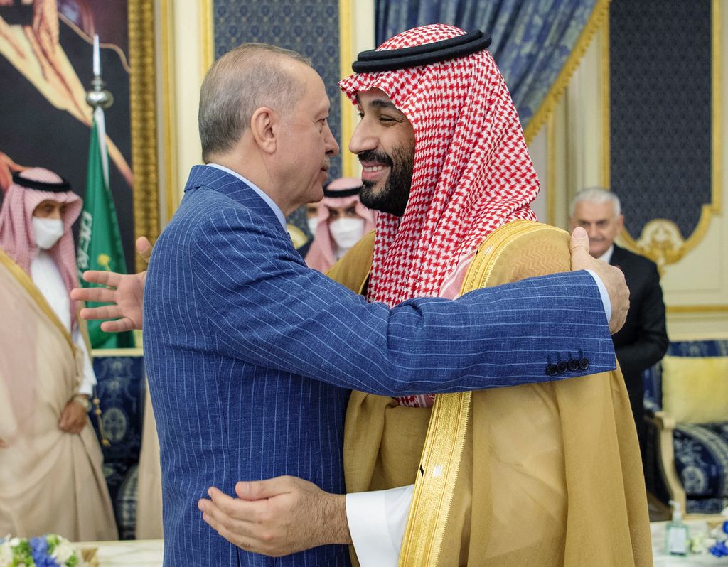 In this photo released by the Saudi Royal Palace, Turkish President Recep Tayyip Erdogan, left, hugs Saudi Arabia's Crown Prince Mohammed bin Salman before a meeting in Jiddah, Saudi Arabia, Thursday, April 28, 2022. Erdogan is visiting Saudi Arabia in a major reset of relations between two regional heavyweights following the slaying of a Saudi columnist in Istanbul. The Turkish presidency said talks in Saudi Arabia will focus on ways of increasing cooperation and the sides will exchange views on regional and international issues.