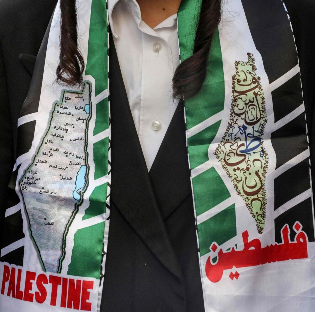 A member of the Neturei Karta orthodox Jewish sect, who rejects the establishment of the state of Israel, wore a shawl with a picture of the Palestinian map with the name in Arabic and English translation reading "Palestine", during a rally in support of Palestinian activist Maher al-Akhras, who is detained in the Israeli-occupied city of Hebron, West Bank, on October 21, 2020.