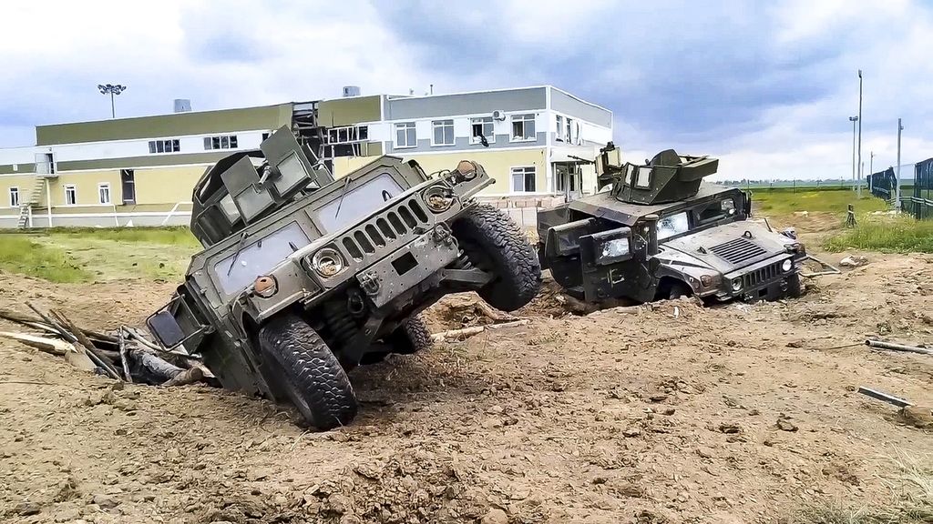 A military convoy consisting of armored vehicles was seen in the aftermath of a battle in the Belgorod region of western Russia on May 23, 2023.