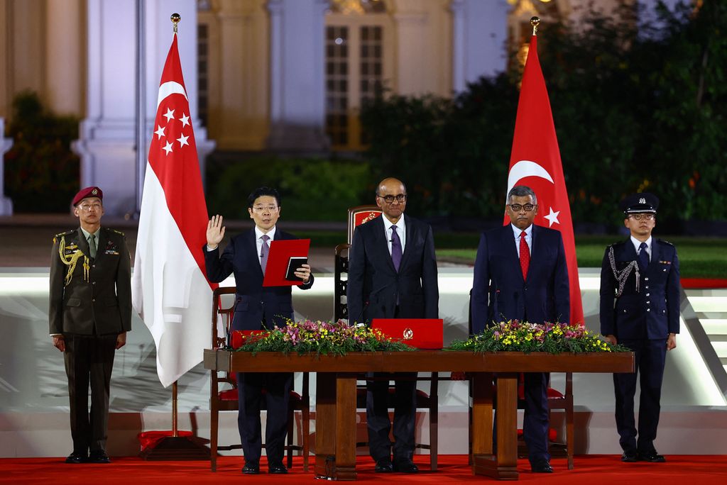 Lawrence Wong (second from left) is sworn in as Prime Minister of Singapore, at the Istana, in Singapore, 15 May 2024. 