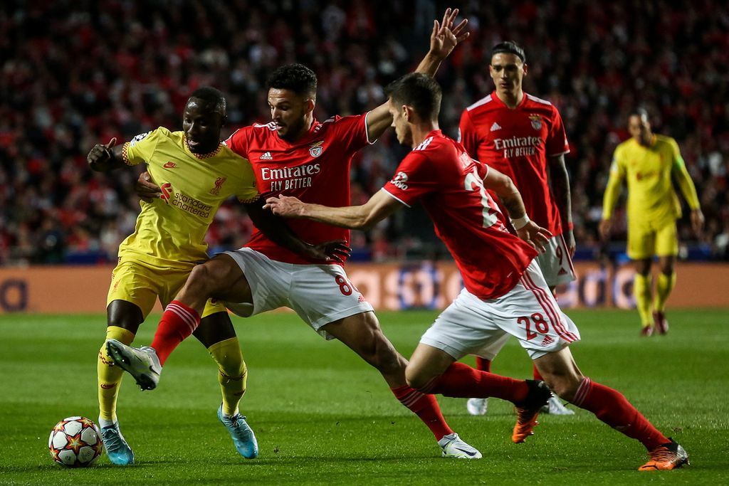 Liverpool midfielder from Guinea, Naby Keita (left), during the UEFA Champions League quarter-final match between Benfica and Liverpool FC in Lisbon, 6 April 2022. Both senior and junior Guinean players play a lot in European leagues.