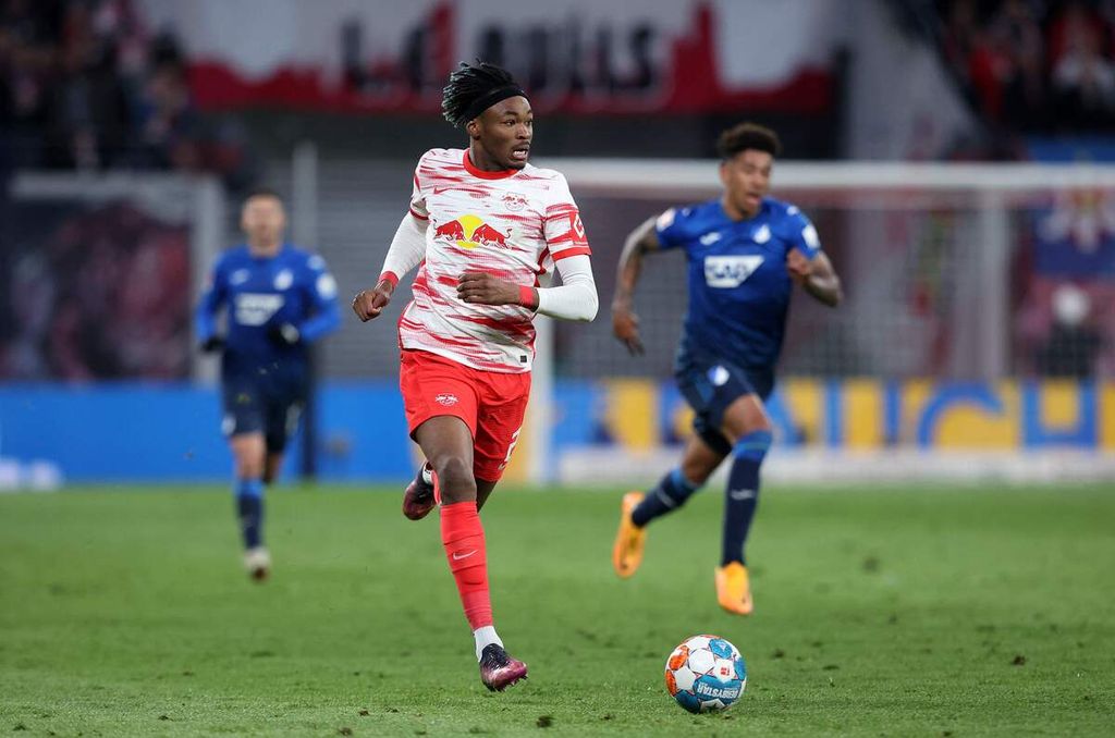 Leipzig's French defender Mohamed Simakan runs with the ball during the German first division Bundesliga football match RB Leipzig v TSG 1899 Hoffenheim in Leipzig, eastern Germany, on April 10, 2022. (