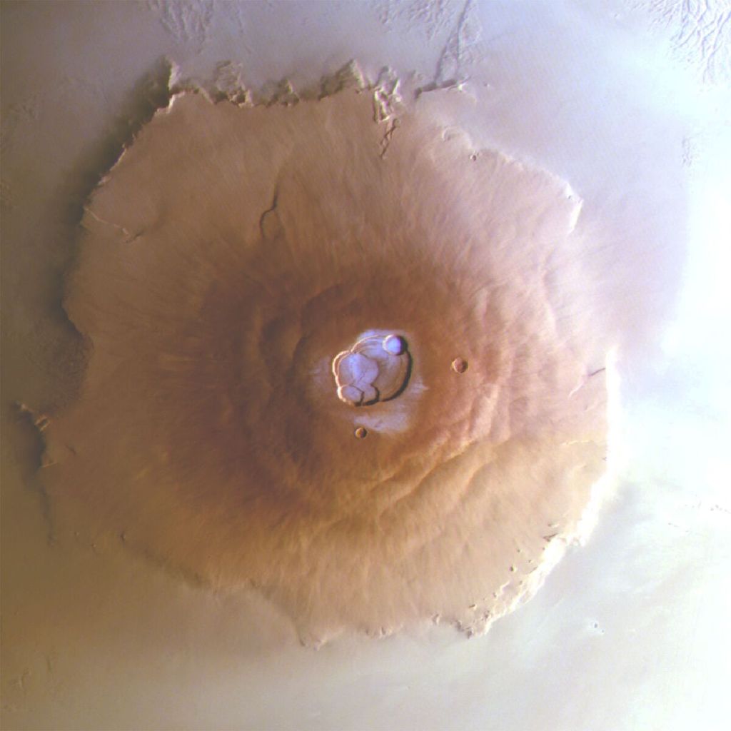 Foto yang diperoleh Badan Antariksa Eropa (ESA) pada Senin (10/6/2024) ini menunjukkan embun beku di puncak gunung berapi Olympus Mons di Mars.  