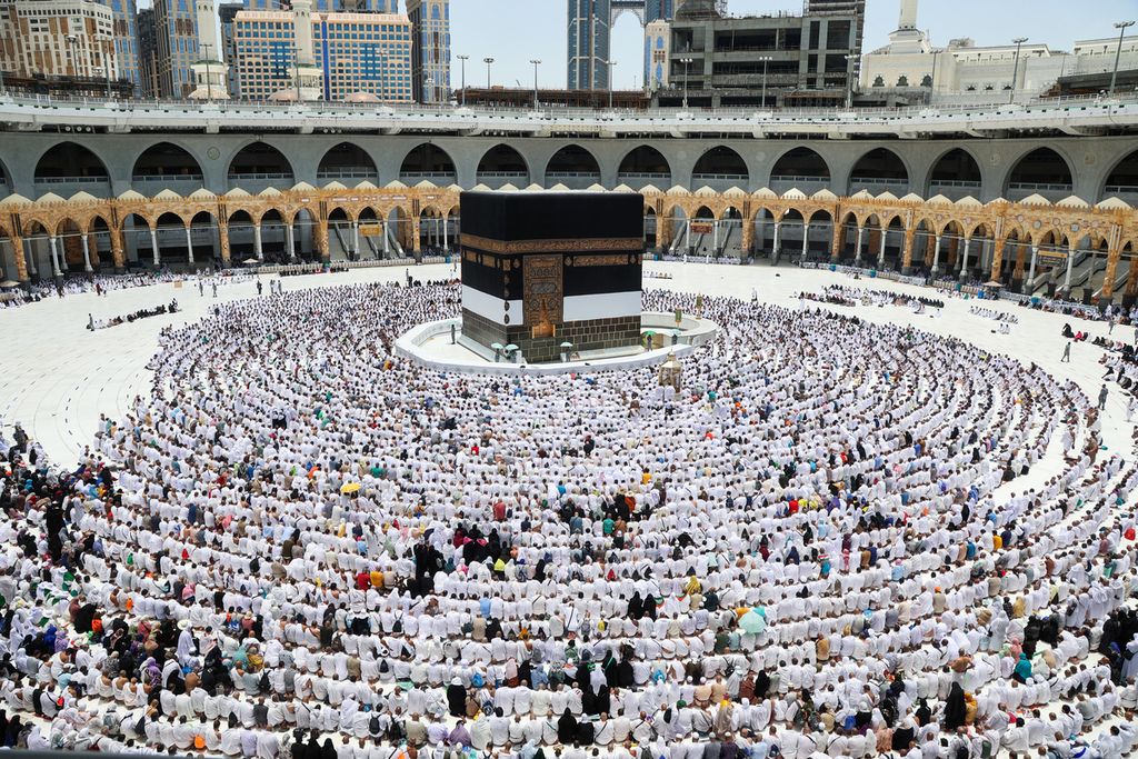 Worshippers pray around the Kaaba, Islam's holiest shrine, at the Grand mosque in the holy Saudi city of Mecca, on the first day of the al-Adha feast celebrated by Muslims worldwide, on July 9, 2022. 