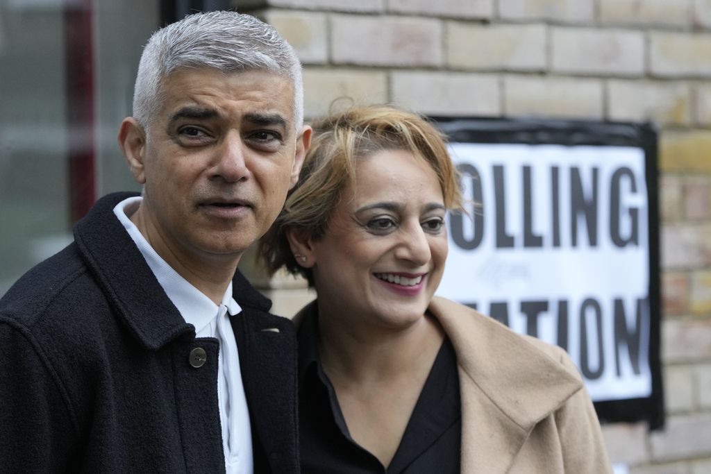 London Mayor Sadiq Khan and his wife, Saadiya Ahmed, posed for a photo with the media as they were about to cast their vote in the London mayoral election in London, England, on May 2, 2024. Khan was re-elected for the third time as London's mayor.