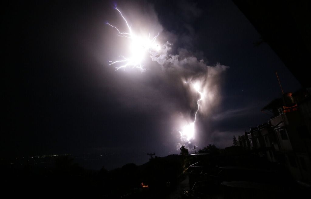 Lightning struck along with ash spewed by the Taal volcano in the city of Tagaytay, Cavite, Philippines, which erupted on Sunday (1/12/2020) evening.