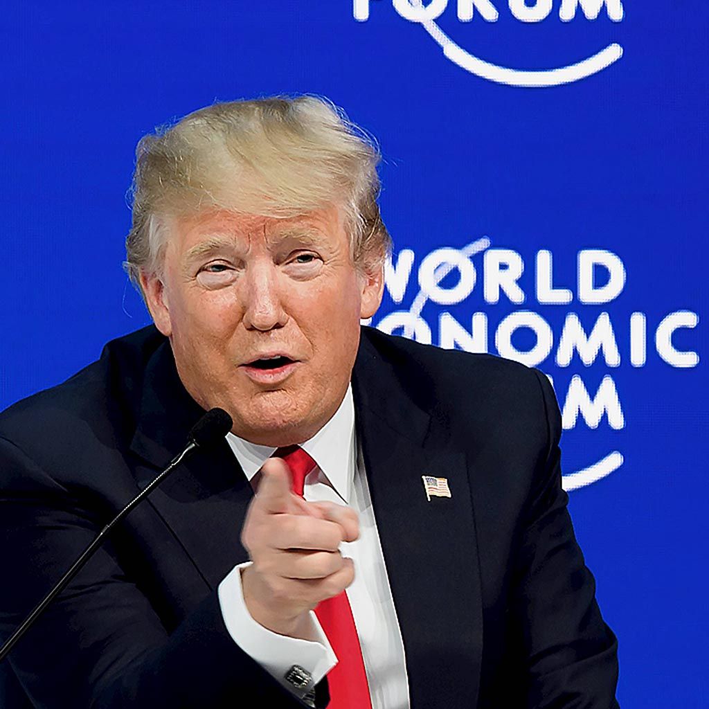 Presiden Trump, Jumat (26/1), memberikan isyarat saat berbicara dalam sebuah diskusi pada pertemuan tahunan WEF di Davos, Swiss.