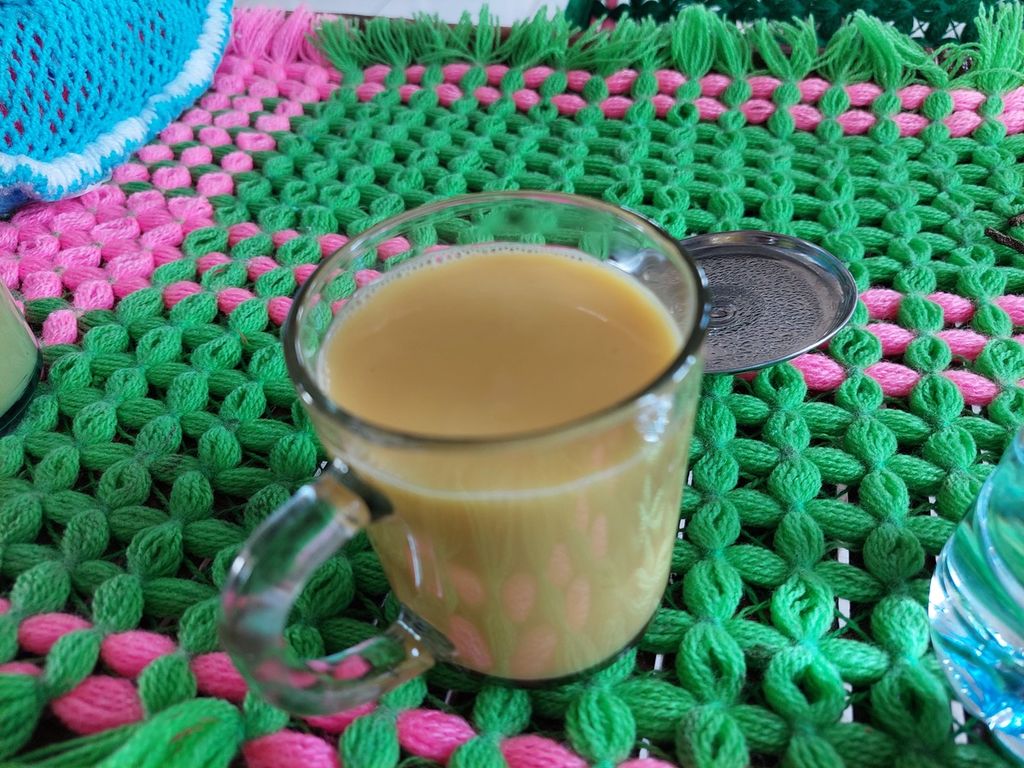 A glass of turmeric milk served by the mothers in North Mollo.