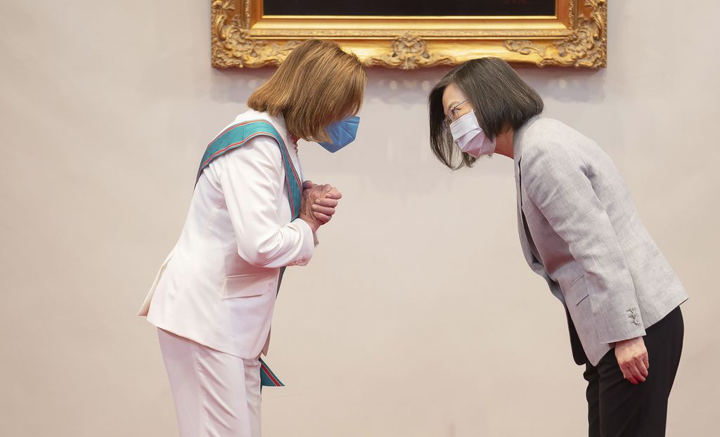 In this photo released by the Taiwan Presidential Office, U.S. House Speaker Nancy Pelosi, left, and Taiwanese President President Tsai Ing-wen gesture during a meeting in Taipei, Taiwan, Wednesday, Aug. 3, 2022. U.S. House Speaker Nancy Pelosi, meeting top officials in Taiwan despite warnings from China, said Wednesday that she and other congressional leaders in a visiting delegation are showing they will not abandon their commitment to the self-governing island. 