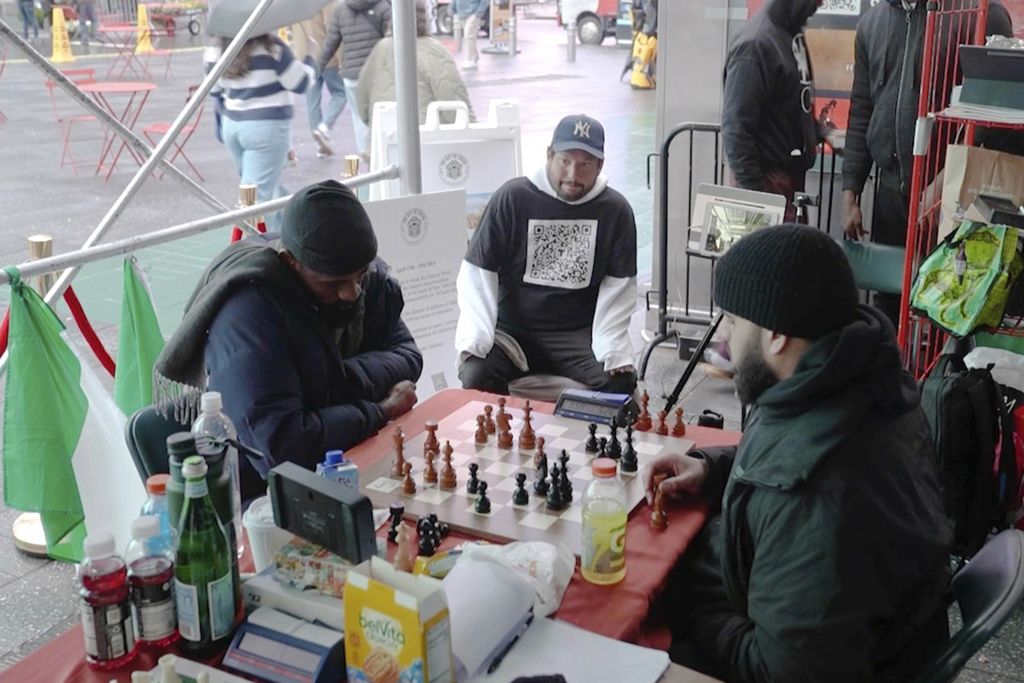 In a screenshot taken from this video, Tunde Onakoya (left), a Nigerian chess master and children's education activist (right), is seen playing chess in Times Square, New York City, USA, on April 18, 2024.