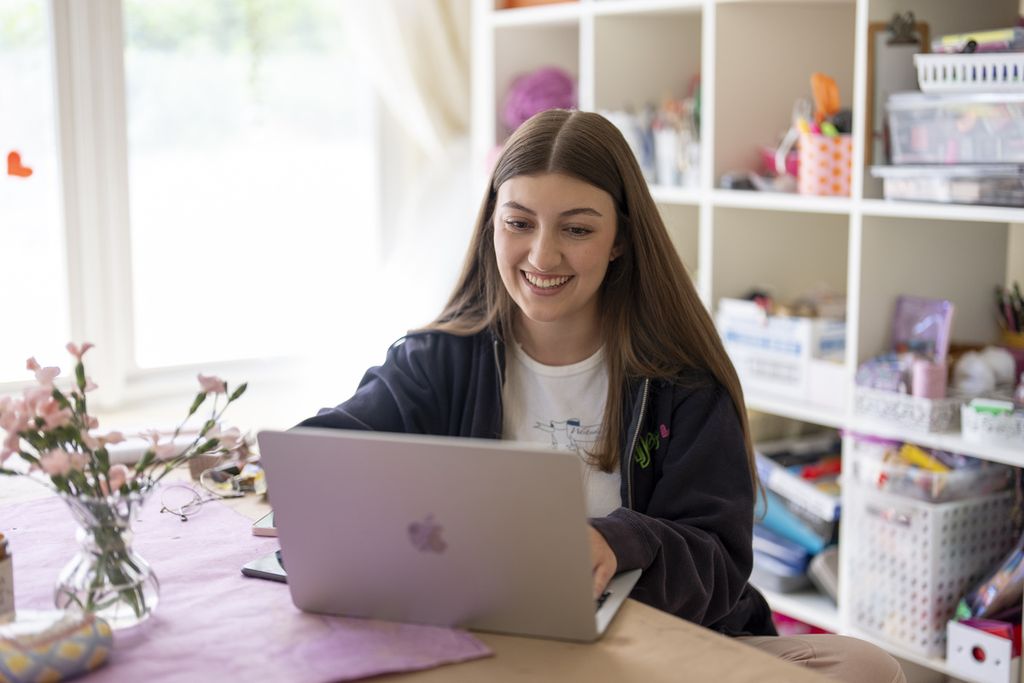 Amea Wadsworth works on a computer at her home on April 19, 2024, in San Diego, USA. 