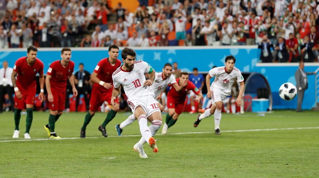 Soccer Football - World Cup - Group B - Iran vs Portugal - Mordovia Arena, Saransk, Russia - June 25, 2018 Iran's Karim Ansarifard scores their first goal from the penalty spot.