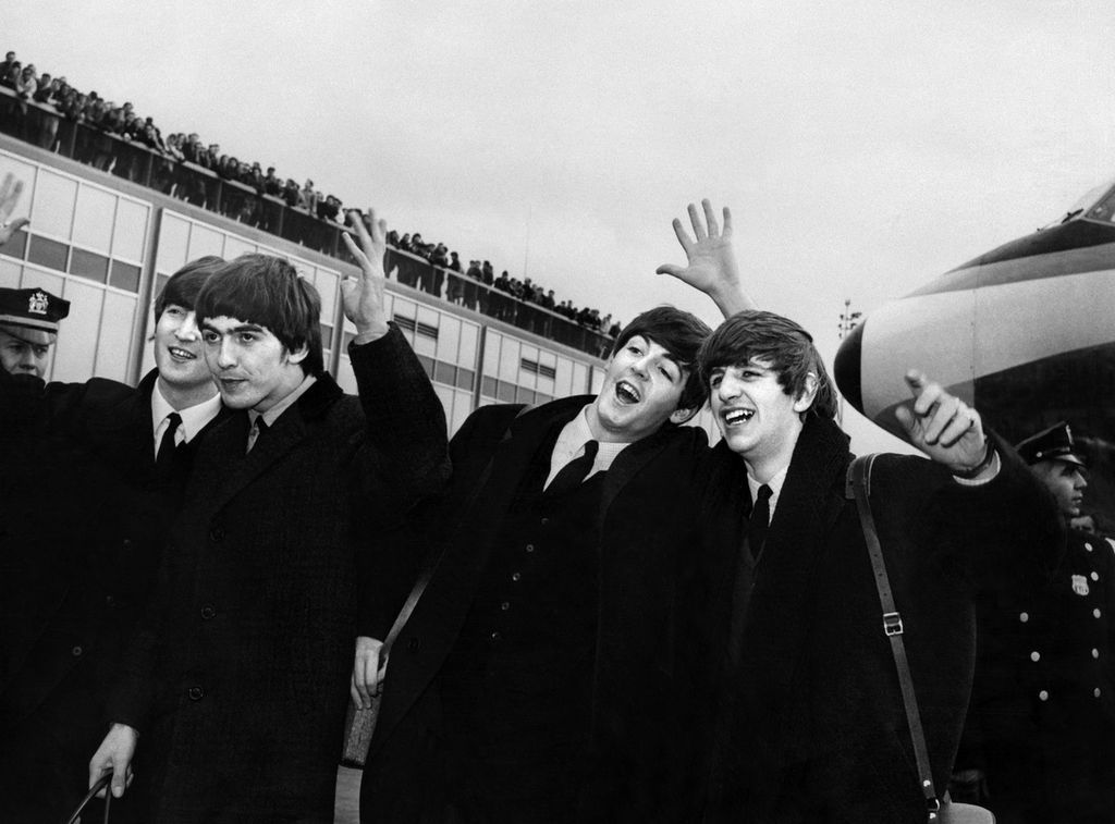 In a photo archive, it shows the British music group, The Beatles. John Lennon, Ringo Starr, Paul McCartney, and George Harrison (from left to right) on February 7, 1964, upon arriving at John F. Kennedy International Airport in New York, USA.