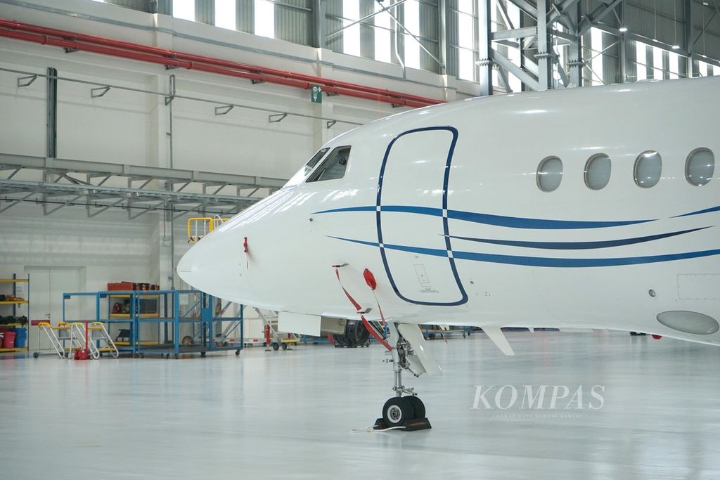 The nose of a Dassault Falcon 2000 business jet during a maintenance period at the ExecuJet MRO Services hangar facility at Subang Airport, Selangor, Malaysia on Thursday (2/5/2024). ExecuJet MRO Services is an MRO (maintenance, repair, and overhaul) company for business jets owned by the French aviation giant, Dassault Aviation.