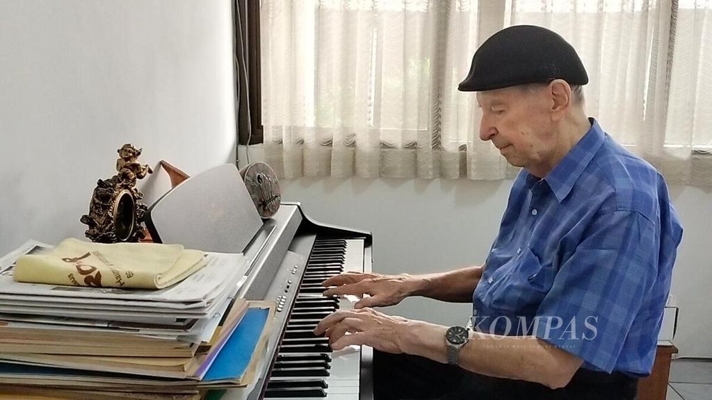 Father Karl-Edmund Prier SJ plays the piano in his office at the Liturgical Music Center in Yogyakarta, Saturday (13/5/2023).
