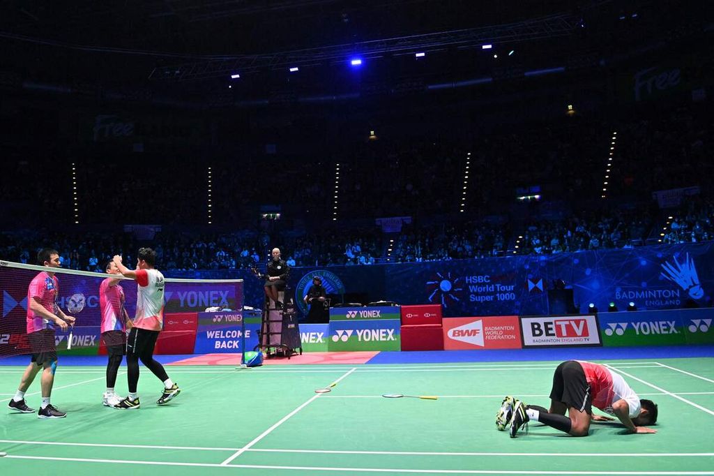 Indonesia's Muhammad Shohibul Fikri (R) and Indonesia's Bagas Maulana celebrate after winning against Indonesia's Mohammad Ahsan and Indonesia's Hendra Setiawan during the men's doubles final at the All England Open Badminton Championship at the Utilita Arena in Birmingham, central England, on March 20, 2022. 