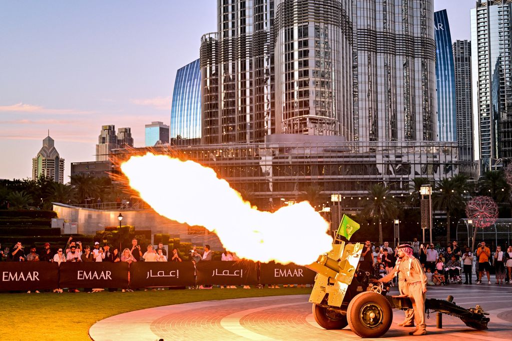 Cannon fire is launched to mark the end of the fast on the second day of the holy month of Ramadan near the Burj Khalifa in downtown Dubai on March 12, 2024.