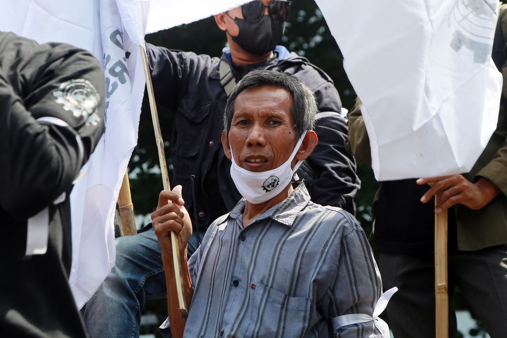 Pekerja migran melakukan aksi di depan kantor Kementerian Perhubungan, Jakarta Pusat, Senin (19/12/2022). 