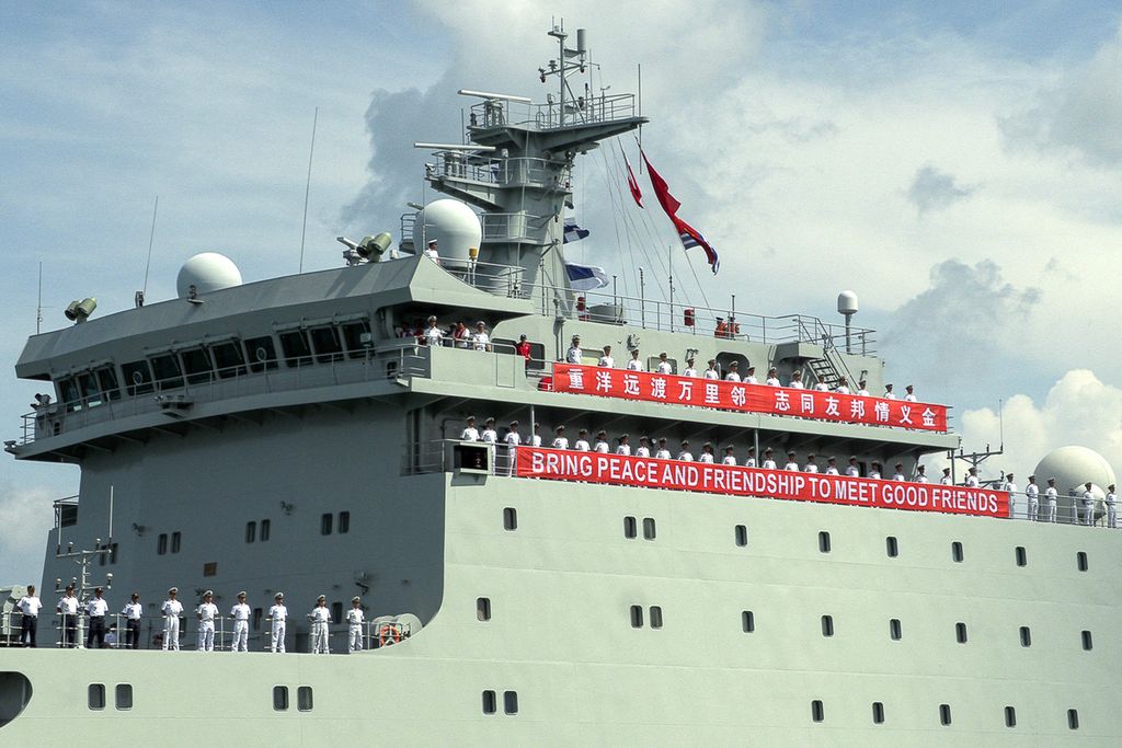 Chinese Navy personnel stand as the Qijiguang training ship prepares to dock at the port of Sihanoukville, Cambodia on May 19, 2024 for joint military exercises.