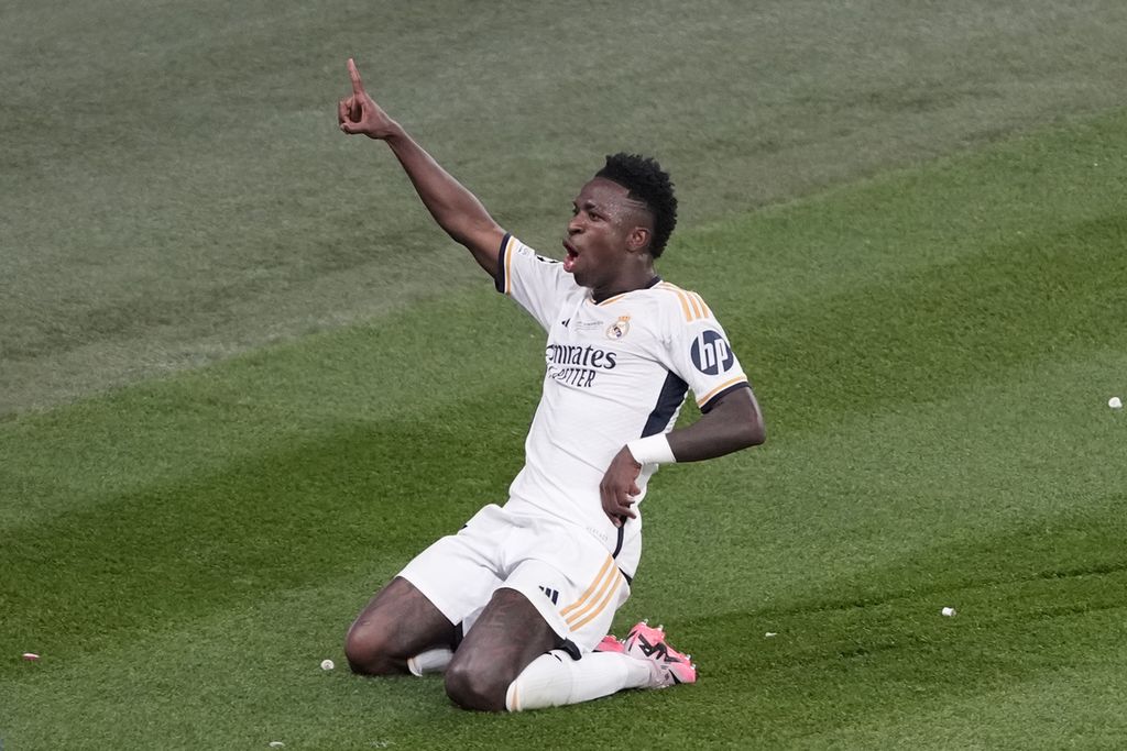 Penyerang Real Madrid, Vinicius Junior, merayakan gol ke gawang Borussia Dortmund pada laga final Liga Champions di Stadion Wembley, London, Minggu (2/6/2024) dini hari WIB. Madrid juara usai menang dengan skor 2-0.