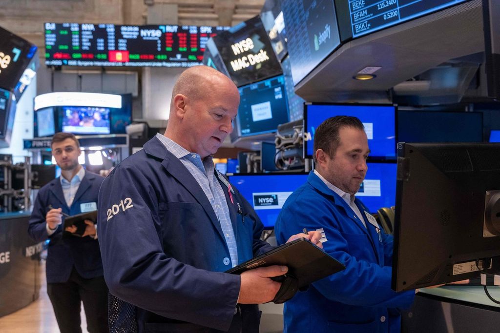 Brokers on the New York Stock Exchange, United States, on March 20, 2024.