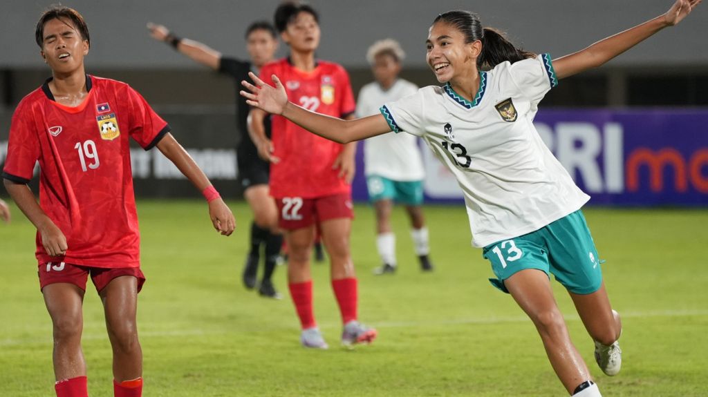 Indonesian women's football player Claudia Scheunemann (right) celebrates scoring a goal against Laos in the AFF U-19 Cup 2023 at the Gelora Sriwijaya Jakabaring Stadium, Palembang, South Sumatra, in July 2023.