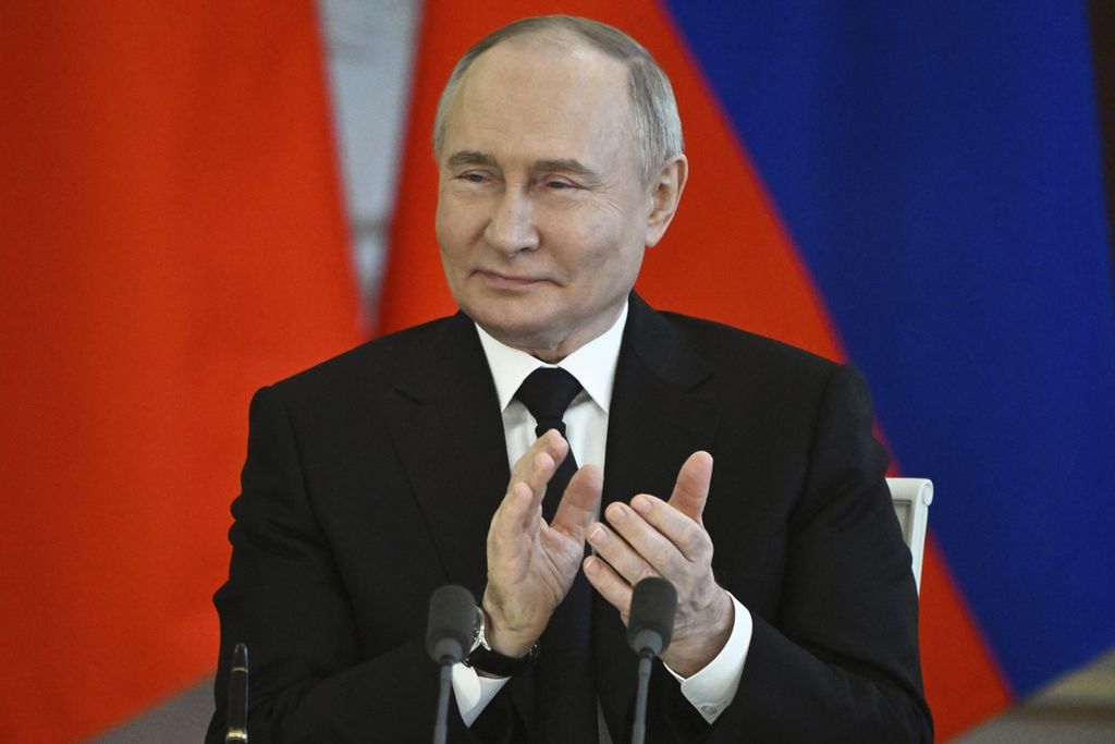 Russian President Vladimir Putin applauded during a signing ceremony following talks with Crown Prince and Prime Minister of Bahrain, Prince Salman bin Hamad bin Isa Al Khalifa in Moscow on May 23, 2024.