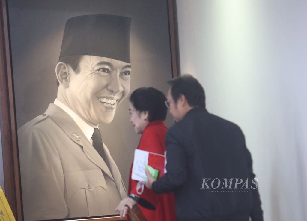Chairperson of the Indonesian Democratic Party of Struggle, Megawati Soekarnoputri, accompanied by her son who is also the Chairman of the PDI-P Central Executive Board, Prananda Prabowo, prepares to deliver her political speech during the 51st anniversary of PDI-P in Lenteng Agung, South Jakarta, on Wednesday (10/1/2024).
