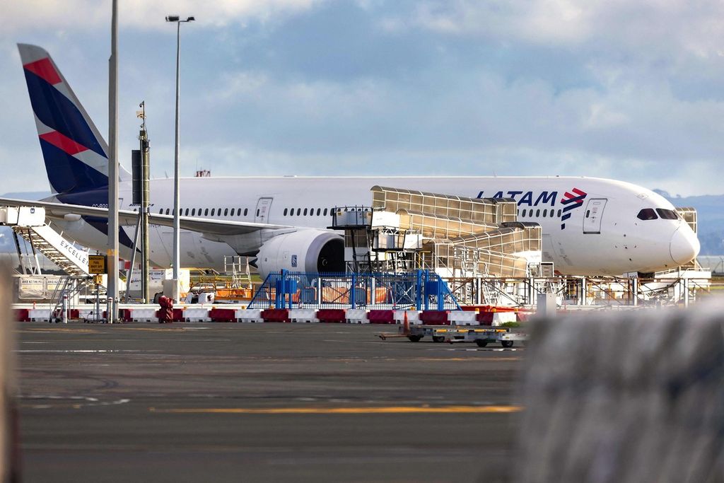 A Boeing 787 aircraft operated by LATAM Air is inspected at Auckland Airport, New Zealand, in March 2024.