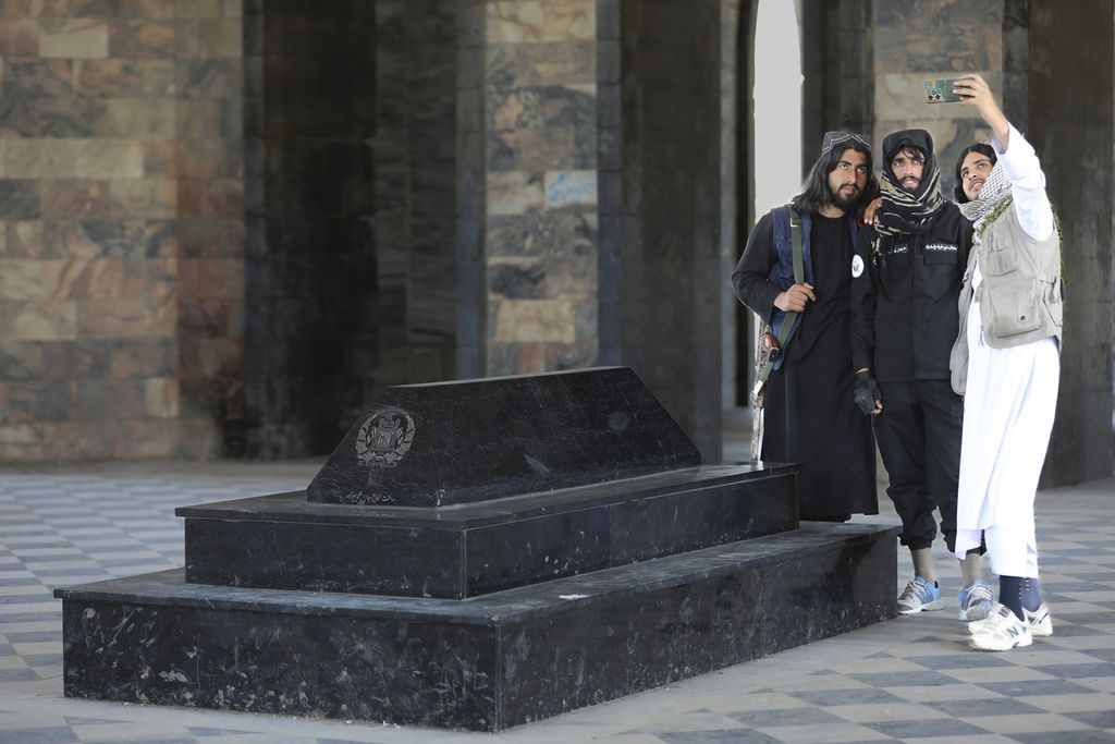 Taliban members take selfies at the tomb of King Nadir Shah (1833-1933) in Kabul, Afghanistan, on April 24, 2024.