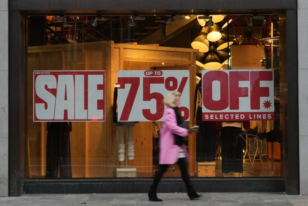 A shopper passes a display window displaying a for sale sign on Oxford Street in London, US, on December 20, 2023. 