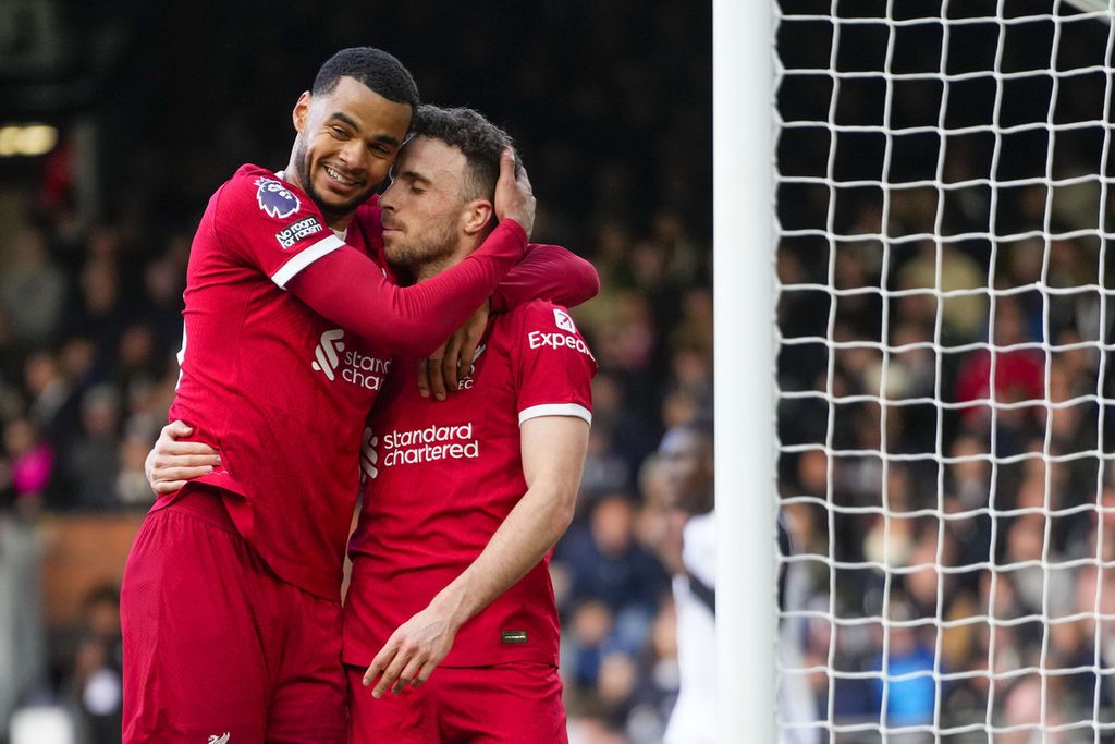 Liverpool striker Diogo Jota (right) and Liverpool winger Cody Gakpo celebrate a goal scored by Jota in the English Premier League match between Fulham and Liverpool at Craven Cottage Stadium, London, early Monday morning on April 22, 2024.