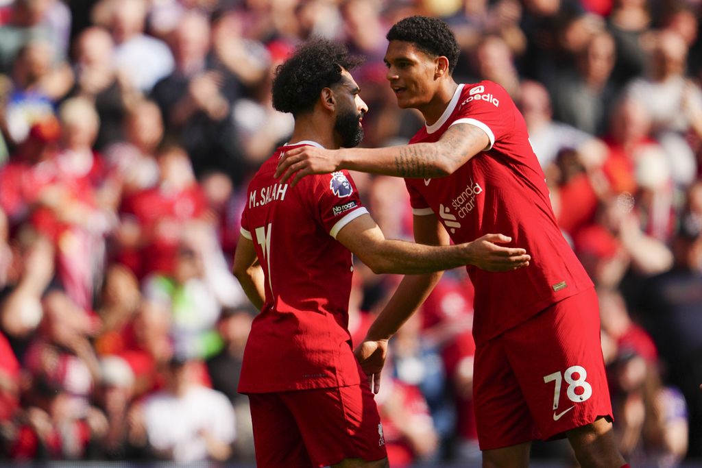Liverpool attacker Mohamed Salah celebrates a goal with defender Jarell Quansah during a Premier League match against Tottenham Hotspur at Anfield Stadium on Sunday (5/5/2024).
