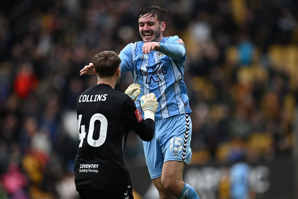 The celebration of Coventry City defender Liam Kitching and goalkeeper Bradley Collins after the FA Cup quarter-final match between Wolverhampton Wanderers and Coventry City at Molineux Stadium in Wolverhampton on Tuesday (16/4/2024). Coventry won 3-2. Coventry will face Manchester United in the FA Cup semi-final at Wembley Stadium in London on Sunday (21/4/2024).