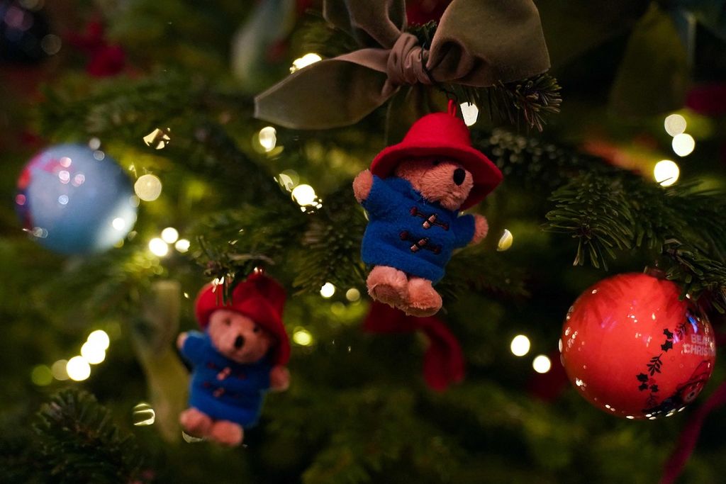 Paddington Bear ornaments are pictured on a Christmas Tree prior to the start of the "Together At Christmas Carol Service" at Westminster Abbey, in London, on December 15, 2022. (Photo by Kirsty O'Connor / POOL / AFP)