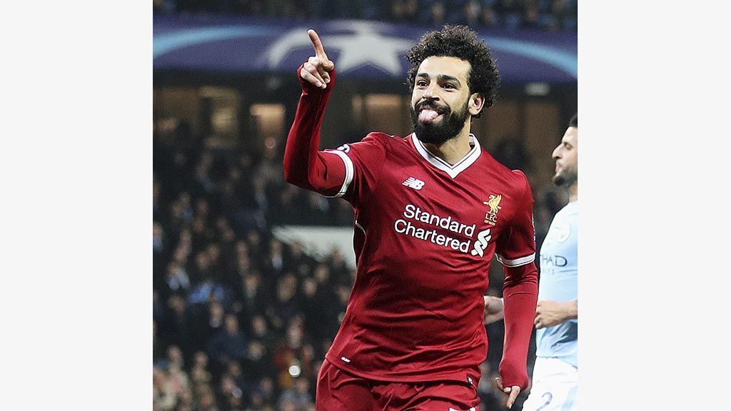 Penyerang Liverpool, Mohamed Salah, merayakan gol ke gawang Manchester City pada laga kedua perempat final Liga Champions di Stadion Etihad, Manchester, Selasa (10/4/2018). 
