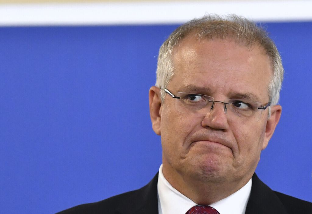 Australian Prime Minister Scott Morrison grimaces during a speech in Brisbane, Australia Tuesday, Jan. 29, 2019. Morrison has raised the prospect of the nation suffering its first economic recession in 28 years if the opposition wins general elections due by late May. (Darren England/AAP Image via AP)