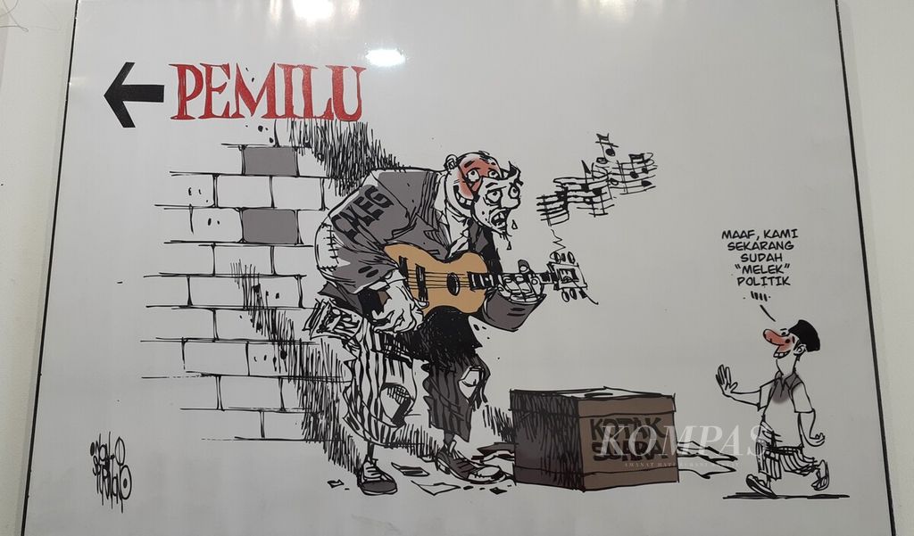 Salah satu kartun karya Non-O (Sudi Purwono) bertema pemilu ditampilkan dalam pameran “Kartun Agawe Rukun” di Balai Budaya Jakarta, Jumat (14/7/2023). Pameran berlangsung hingga 19 Juli mendatang.