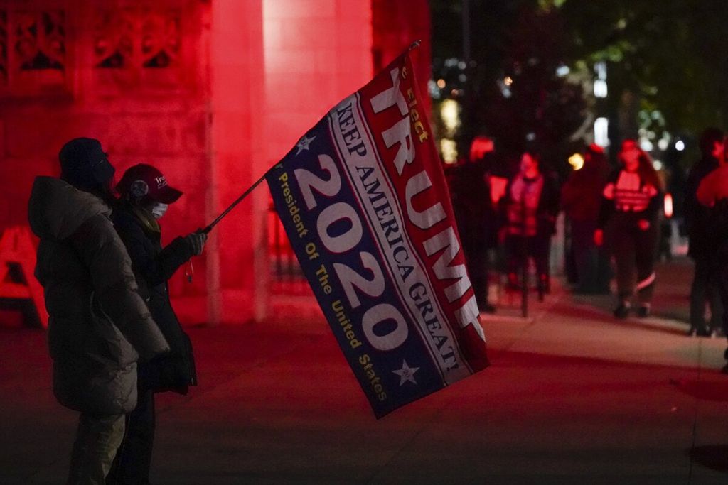 Supporters of United States President Donald Trump waved their flags of support during the voting process in the US election at Scranton Cultural Center, Pennsylvania, USA on November 3, 2020.
