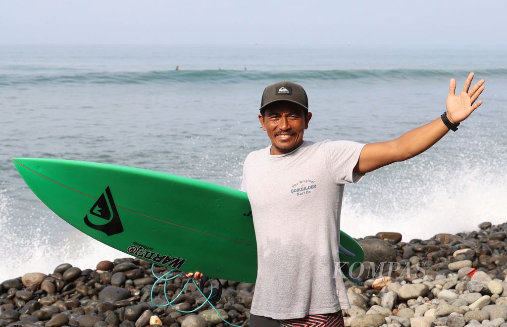 Dede Suryana, a professional surfer from Cimaja, West Java, poses after surfing at Cimaja Beach, Sukabumi Regency, West Java, on Wednesday (May 24, 2023).