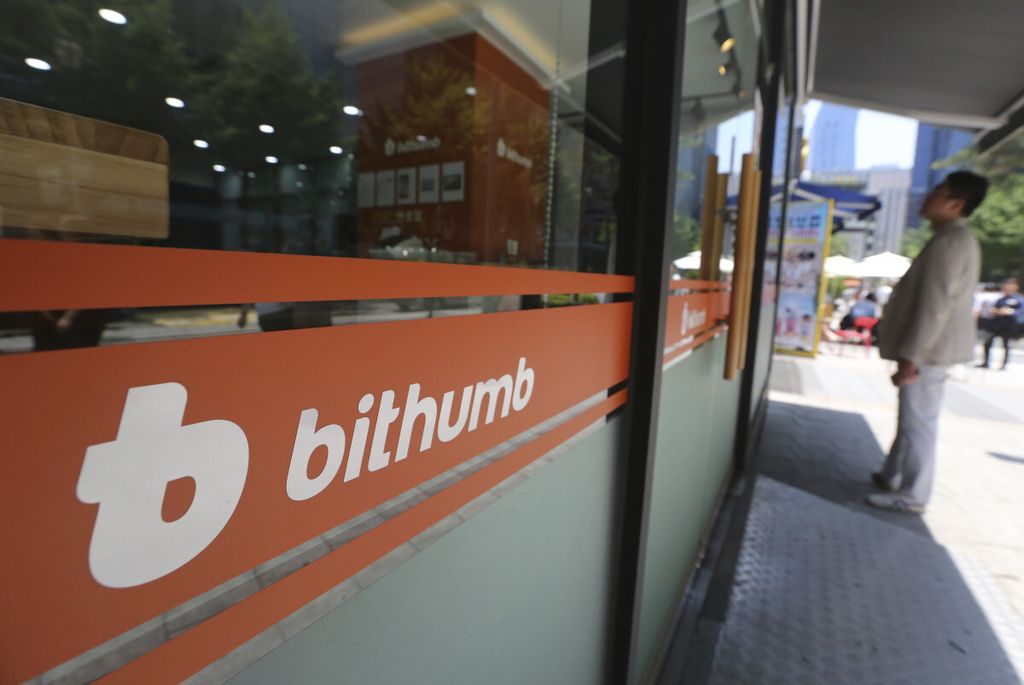 A man watches the prices of bitcoin at Bithumb cryptocurrency exchange in Seoul, South Korea, Wednesday, June 20, 2018. Bithumb, South Korea's second-largest exchange, said Wednesday that $31 million worth of virtual currencies have been stolen by hackers, a latest in the series of recent hacks that raised security concerns. (AP Photo/Ahn Young-joon)