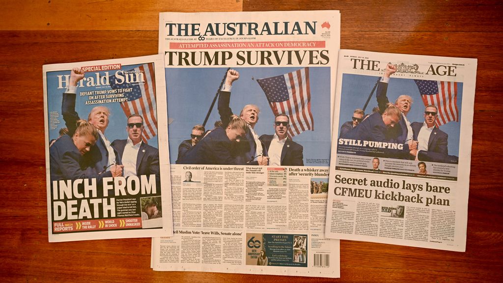 Surat kabar pagi di Melbourne, Senin (15/7/2024), menampilkan berita utama dan foto-foto setelah upaya pembunuhan terhadap kandidat Partai Republik, Donald Trump, di Butler, Pennsylvania, pada 13 Juli 2024. 