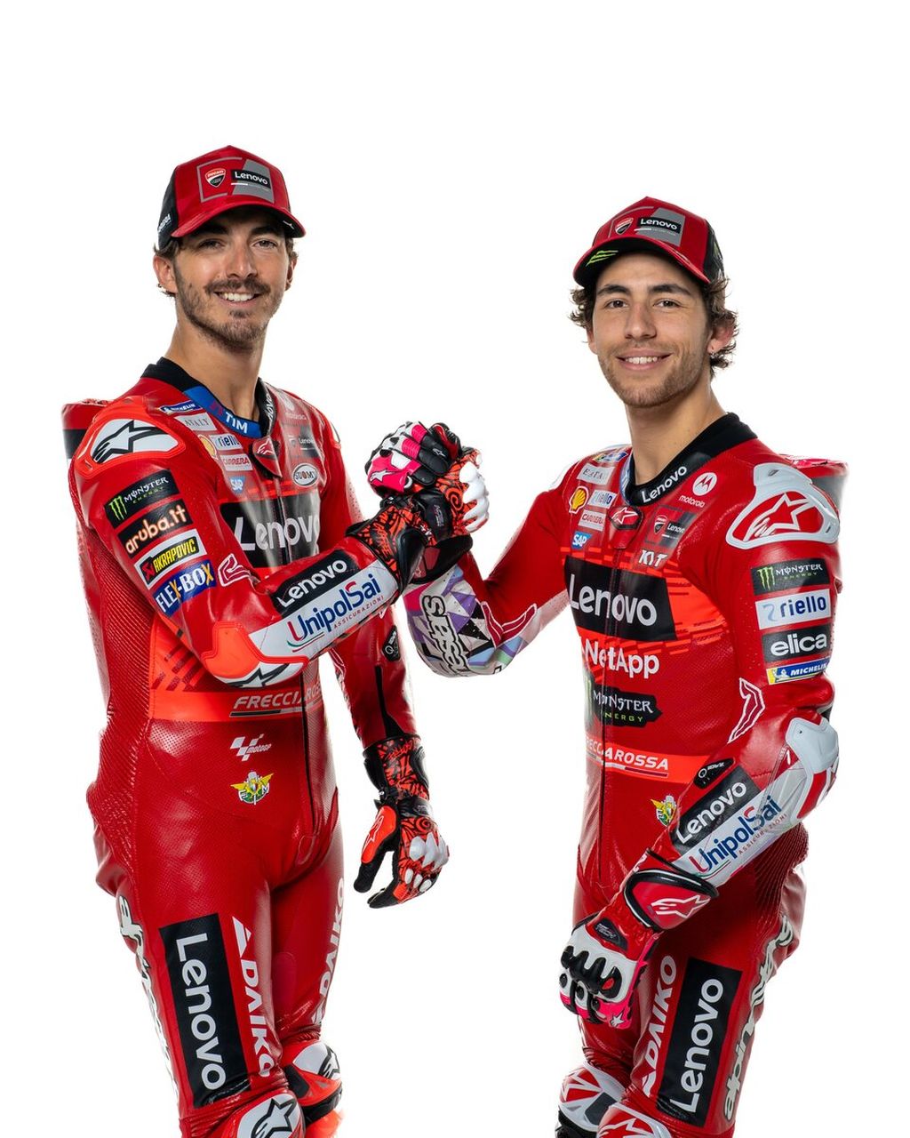 Pebalap tim Ducati Lenovo, Francesco Bagnaia (kiri) dan Enea Bastianini, berpose dalam peluncuran tim MotoGP 2024 di Madonna di Campiglio, Trentino, Italia, Senin (22/1/2024).