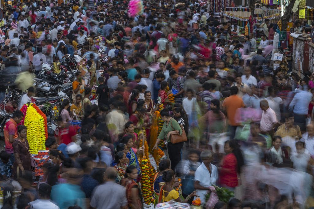 Thousands of people shop on the eve of Diwali, the Hindu festival of lights, in Mumbai, India, Sunday , Oct. 23, 2022. Diwali is one of Hinduism's most important festivals, dedicated to the worship of the goddess of wealth Lakshmi. On 15 November 2022, the world's human population was estimated at 8 billion.. 